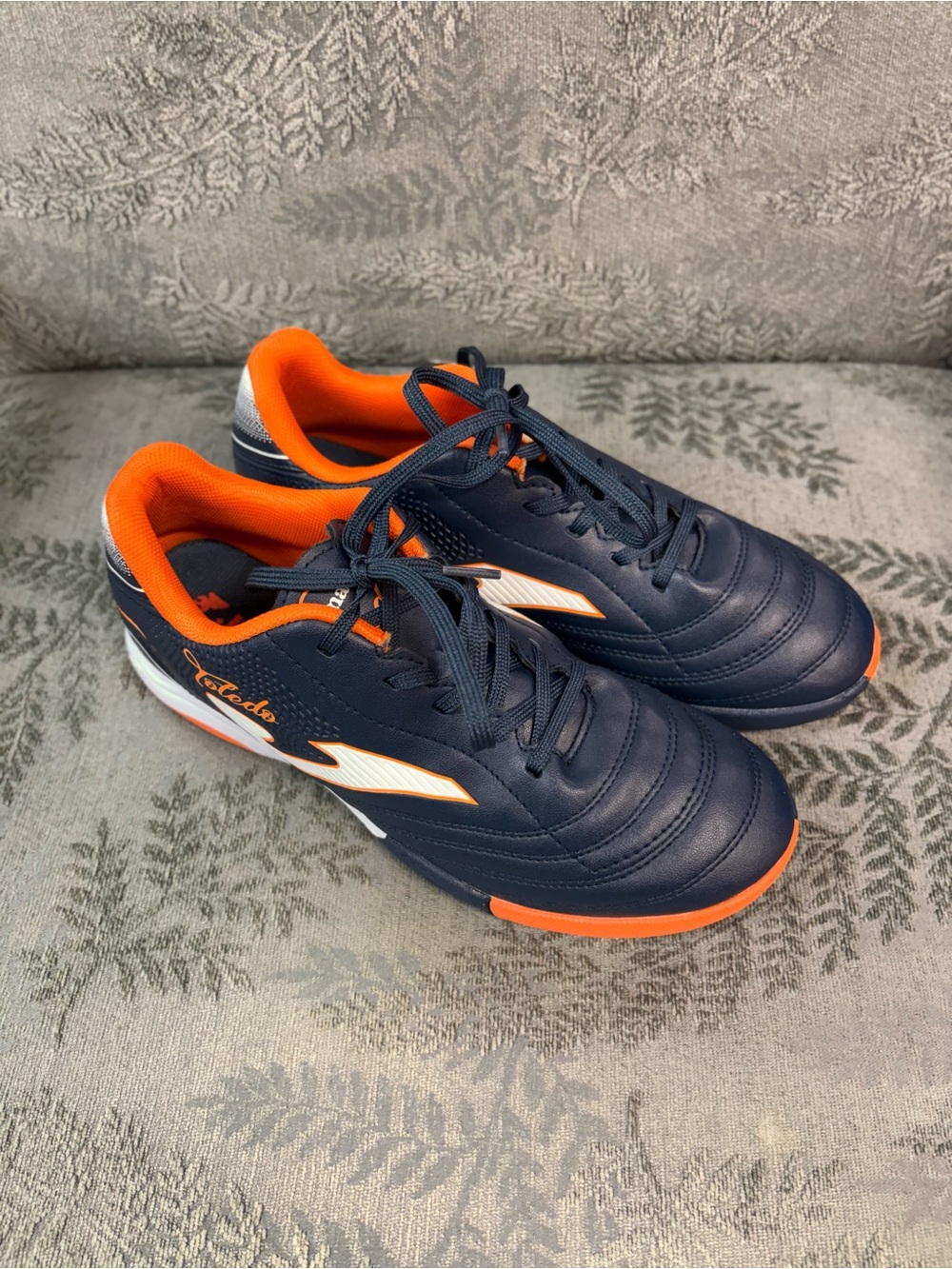 Joma Boys Turf Shoes Navy and Orange in Color